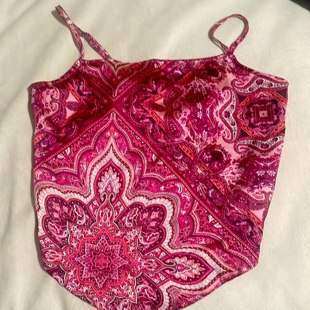 A nice pink magenta and fuchsia top that is tied from that back only wore once